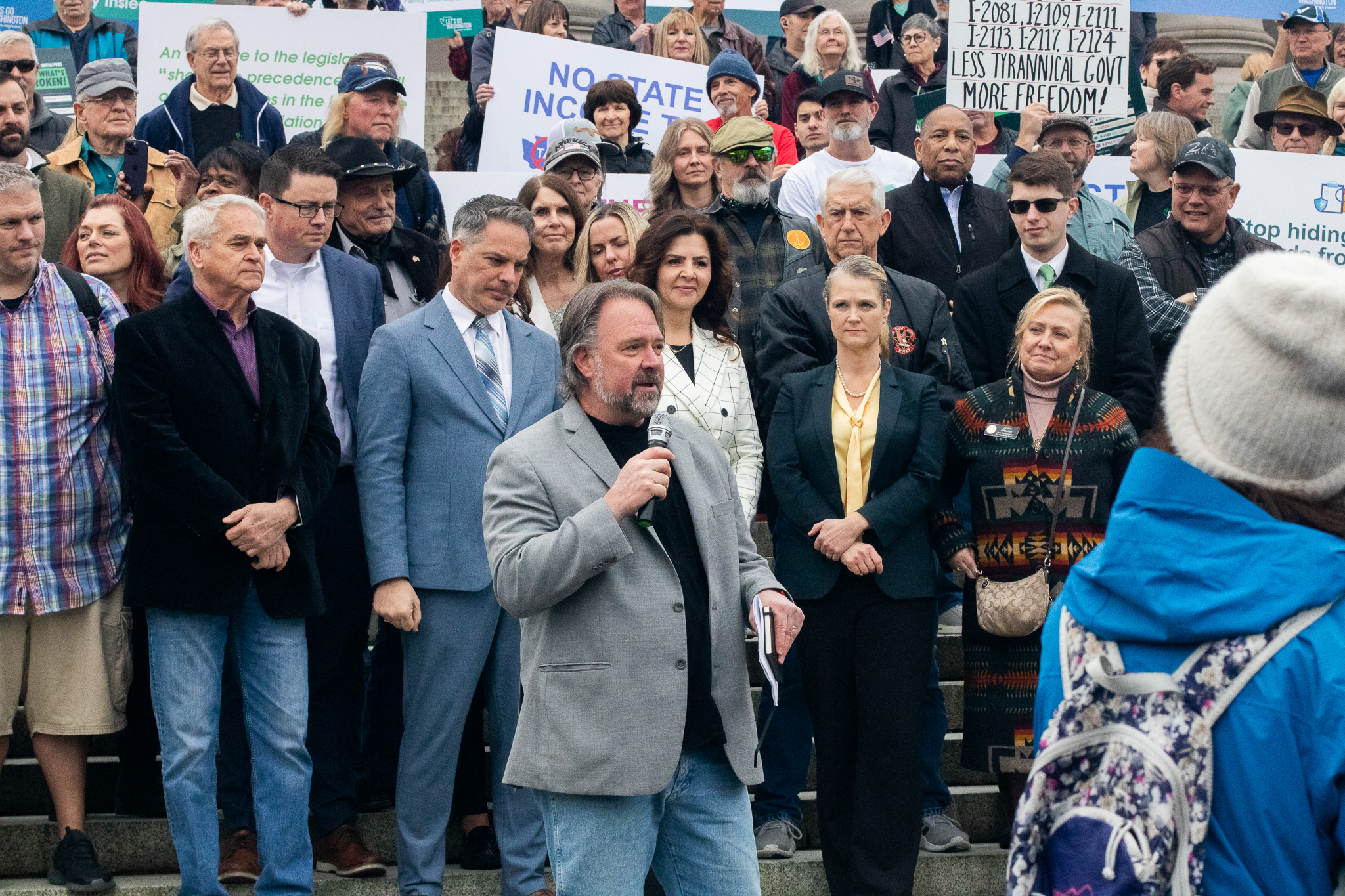 Republican hedge fund mogul Brian Heywood speaks at a rally for the initiatives he bankrolled