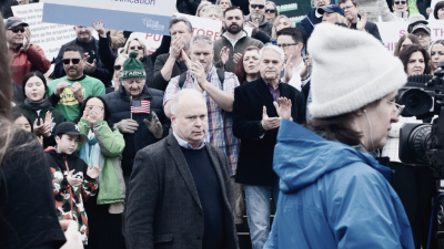 WA GOP Chair Jim Walsh glowers at a rally for the three Republican initiatives to give the wealthy few a tax cut at our expense